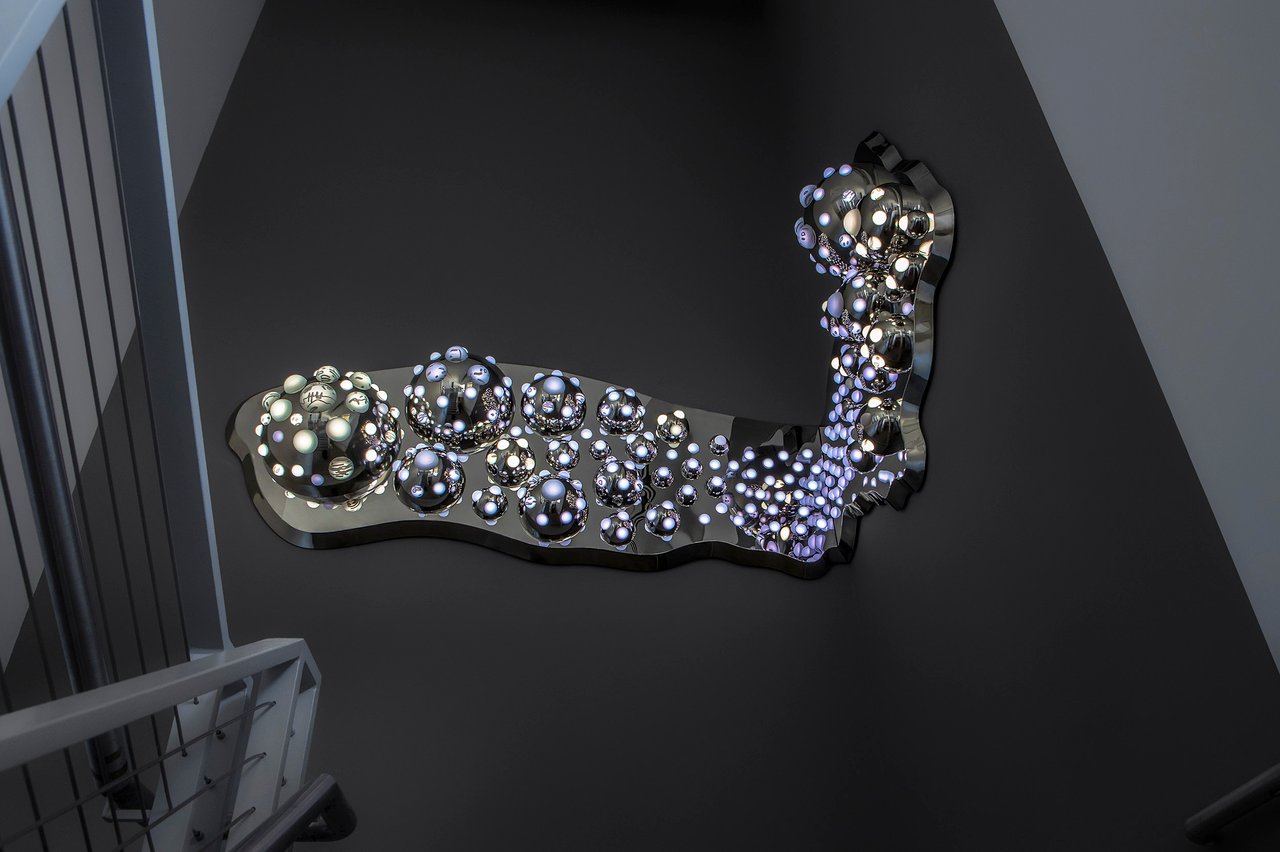 Grimanesa Amorós ARGENTUM, 9 x 5 ft 4 in x 5 ft 4 in LED sculpture and light sculpture now in the permanent collection of The Bronx Museum of the Arts, Bronx, New York, 2024. Made of stainless steel, diffusion and reflective material, LEDs, and custom lighting sequence, its two interlocking sections embody the geographic and cultural bond between Manhattan and the Bronx. Permanent collection exhibition of LED sculpture and light sculpture by Grimanesa Amorós at The Bronx Museum of the Arts.