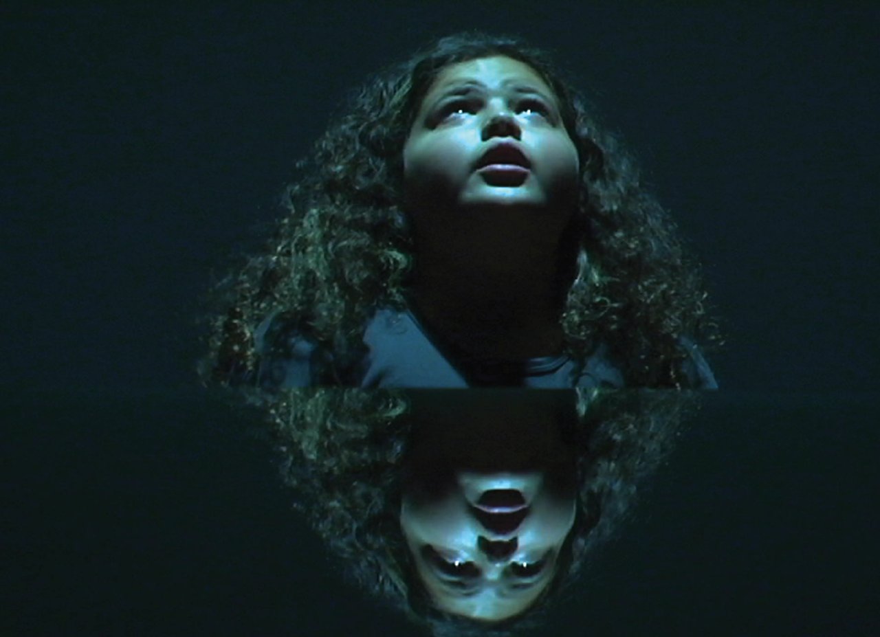 Grimanesa Amorós REFLEXION OBSCURA photography documenting the REFLEXION OBSCURA video, confronting the psychological and physical impact of child abuse through the performance of a child, exploring the depth and complexity of suppressed pain to allow viewers to engage with the subject through their own experiences. Photography by Grimanesa Amorós, 2006.