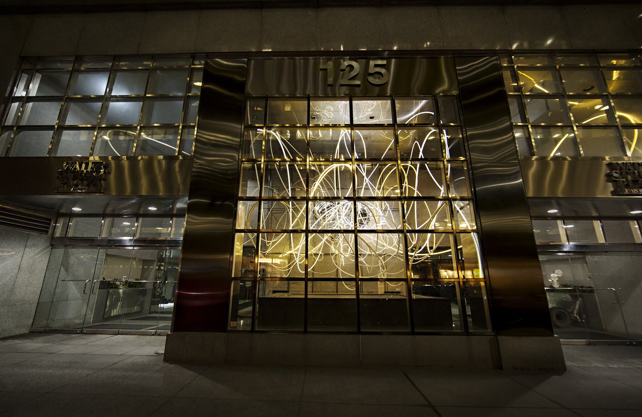 Grimanesa Amorós BREATHLESS MAIDEN LANE, 25-foot public art light sculpture and LED sculpture suspended in the atrium of 125 Maiden Lane, Financial District, New York, 2014. An interlocking matrix of white and gold LED tubing in stainless steel, diffusion and reflective material tracing Lower Manhattan's pre-grid organic street patterns, the light bouncing off marble walls, stainless steel ceiling, and glass facade at night. Commissioned by Time Equities Art-in-Buildings. LED sculpture by Grimanesa Amorós.