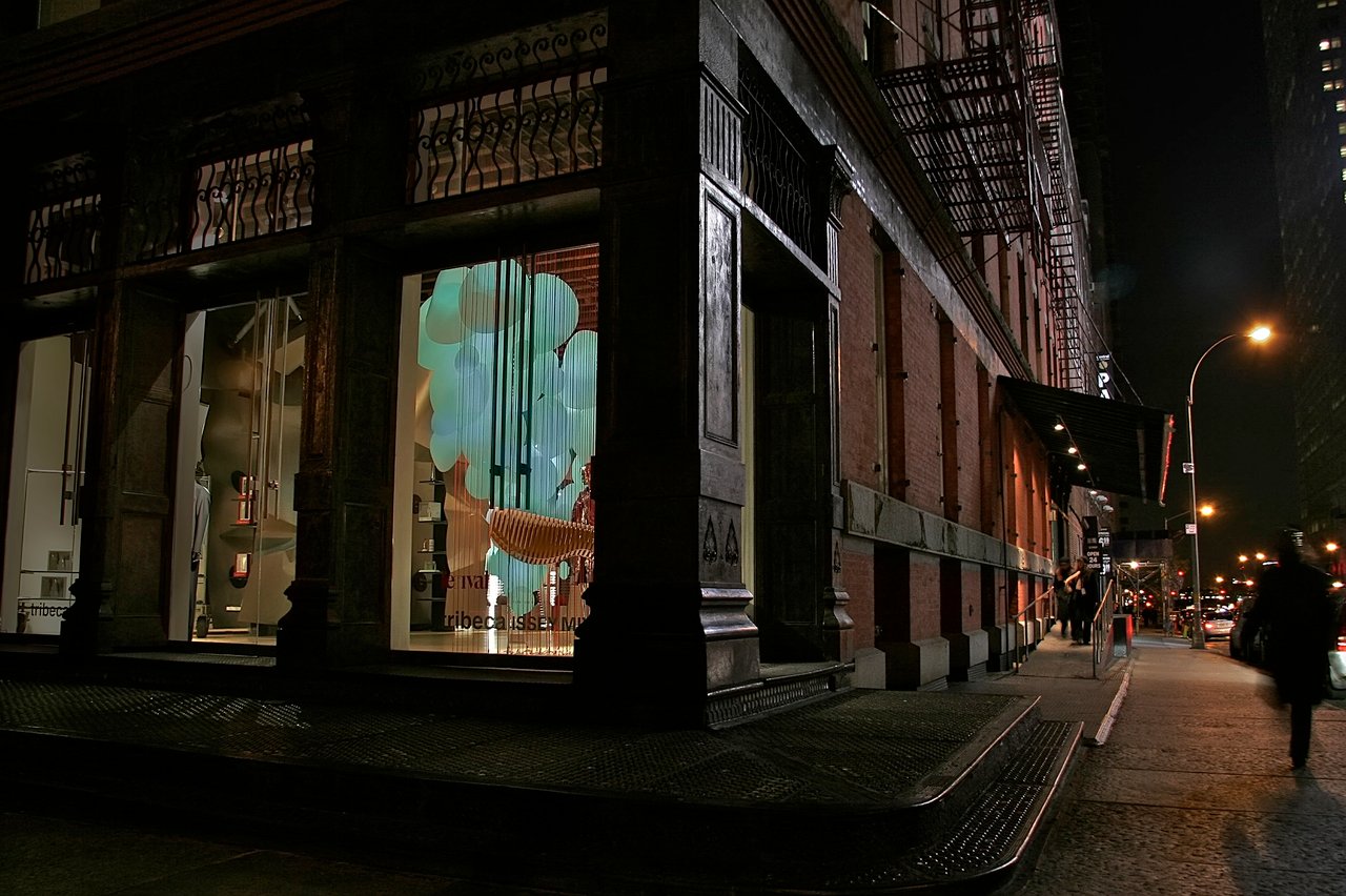 Grimanesa Amorós AURORA, 13 x 8 x 6-foot commissioned LED sculpture and light sculpture in the storefront window of Tribeca ISSEY MIYAKE headquarters, New York, 2009 to 2010. Made of stainless steel, diffusion and reflective material, and LEDs, its form was inspired by the sweeping strips of shifting color of the Aurora Borealis, its light unfolding like stars across the polar horizon within Frank Gehry's boutique. Light sculpture by Grimanesa Amorós.