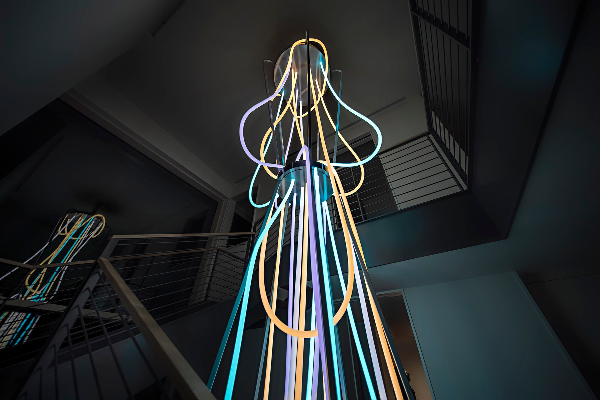 Grimanesa Amorós AETERNUM — 16-foot private commission LED sculpture and light sculpture at a residence, Shelter Island, New York, 2023. Made of LEDs and diffusion material, this vertical hourglass light sculpture draws on the ancient Incan lunisolar calendar to meditate on the eternal dance between sun and moon, conceived as a tribute to two collectors who see themselves as twin flames. Light sculpture by Grimanesa Amorós.