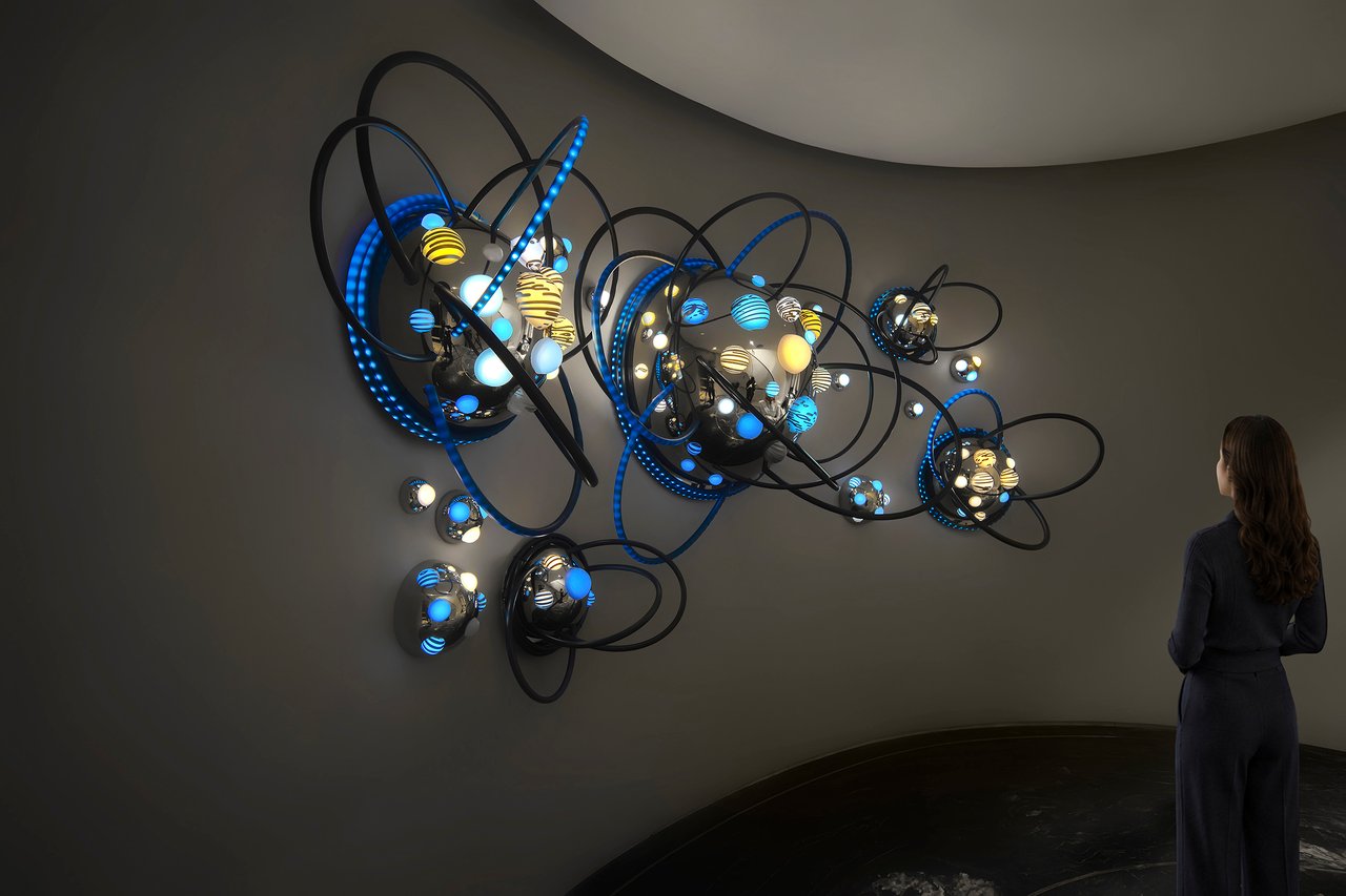 Grimanesa Amorós AZURE — site-specific LED sculpture and light sculpture series at an Upper East Side Landmark Town House, New York, 2023. 14 x 6 x 3-foot round reflective stainless steel and LED art domes installed on a concave wall, their custom light sequences playing off one another in shifting interplay inspired by the Azalea flower's contradictory beauty and hidden toxicity. Private light sculpture by Grimanesa Amorós.