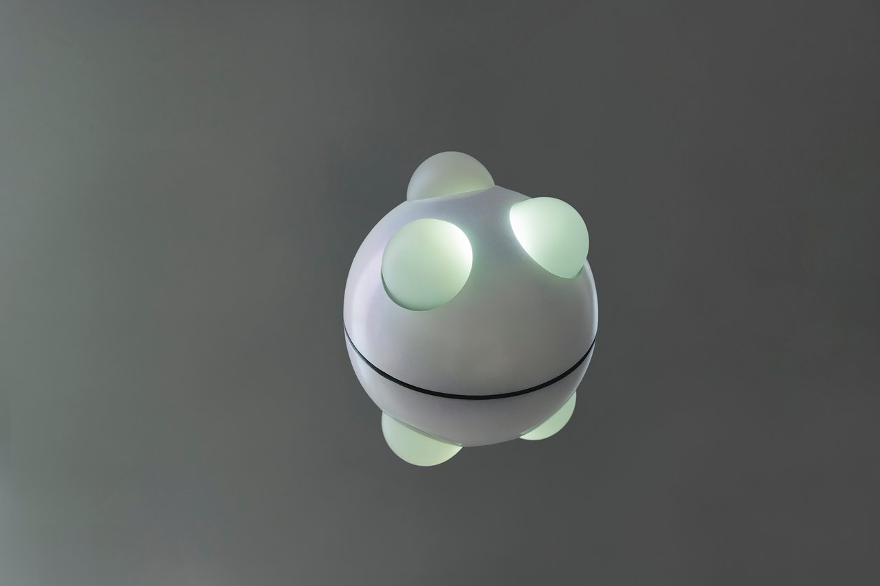 Grimanesa Amorós CAPPED WAVES Pearlescent, light sculpture available in three sizes, 6 x 6 x 4 inches, 9 x 9 x 6 inches, and 12 x 12 x 8 inches, made of stainless steel, diffusion and reflective material, LEDs, and custom lighting sequence, each piece featuring a unique lighting sequence inspired by the artist's childhood memories of ocean foam on the Pacific coast of Lima, Peru, ranging from crashing waves to the gentle ebb and flow of sea foam. Light sculpture by Grimanesa Amorós, 2025.
