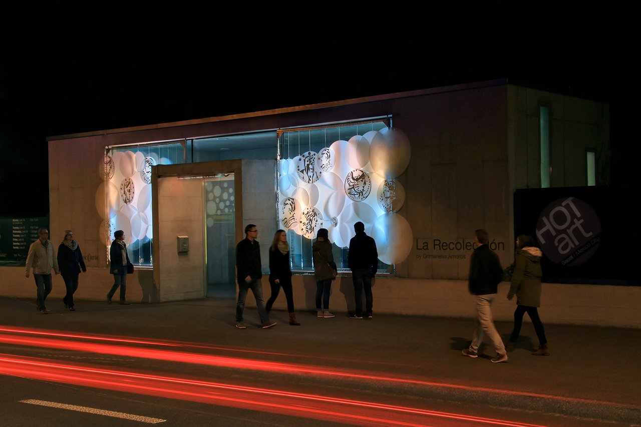 Grimanesa Amorós LA RECOLECCIÓN, public art light sculpture and outdoor LED sculpture on the Claramatte Parkhaus facade, Art Basel, Basel, Switzerland, 2010. A large-scale LED art installation activating the exterior of a parking structure during Art Basel, merging contemporary light sculpture with one of the world's most important art fair landscapes. Outdoor LED sculpture by Grimanesa Amorós.