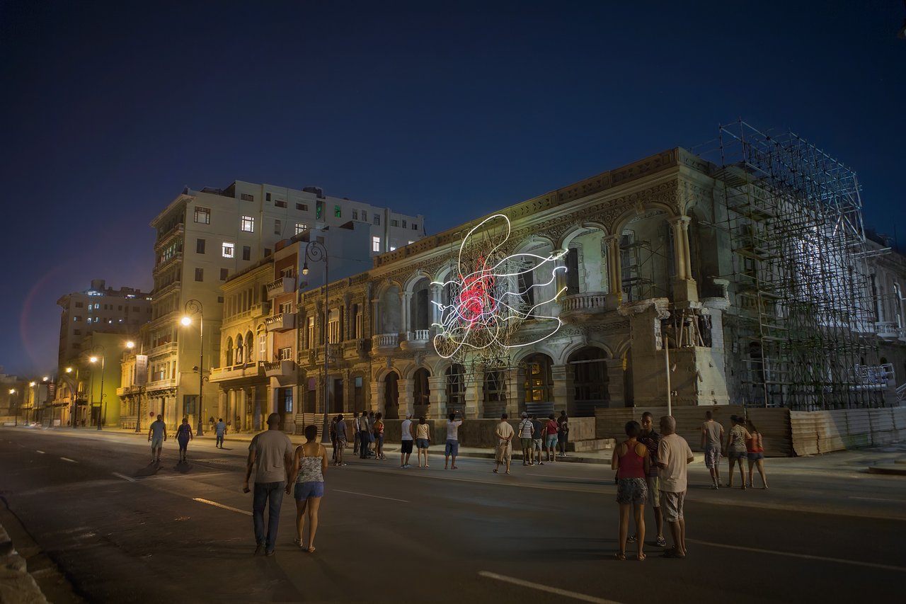 Grimanesa Amorós MARIPOSA DORADA, 55 x 35 x 10-foot public art light sculpture and outdoor LED sculpture at the 13th Havana Biennial, Cuba, 2019. Made of stainless steel, diffusion and reflective material, and LEDs, this monumental light sculpture is inspired by Cuba's national flower, the Flor de Mariposa, whose shifting LED sequence weaves a perpetually changing dance of brilliance embodying the Cuban people's spirit and indomitable will. Outdoor light sculpture by Grimanesa Amorós.
