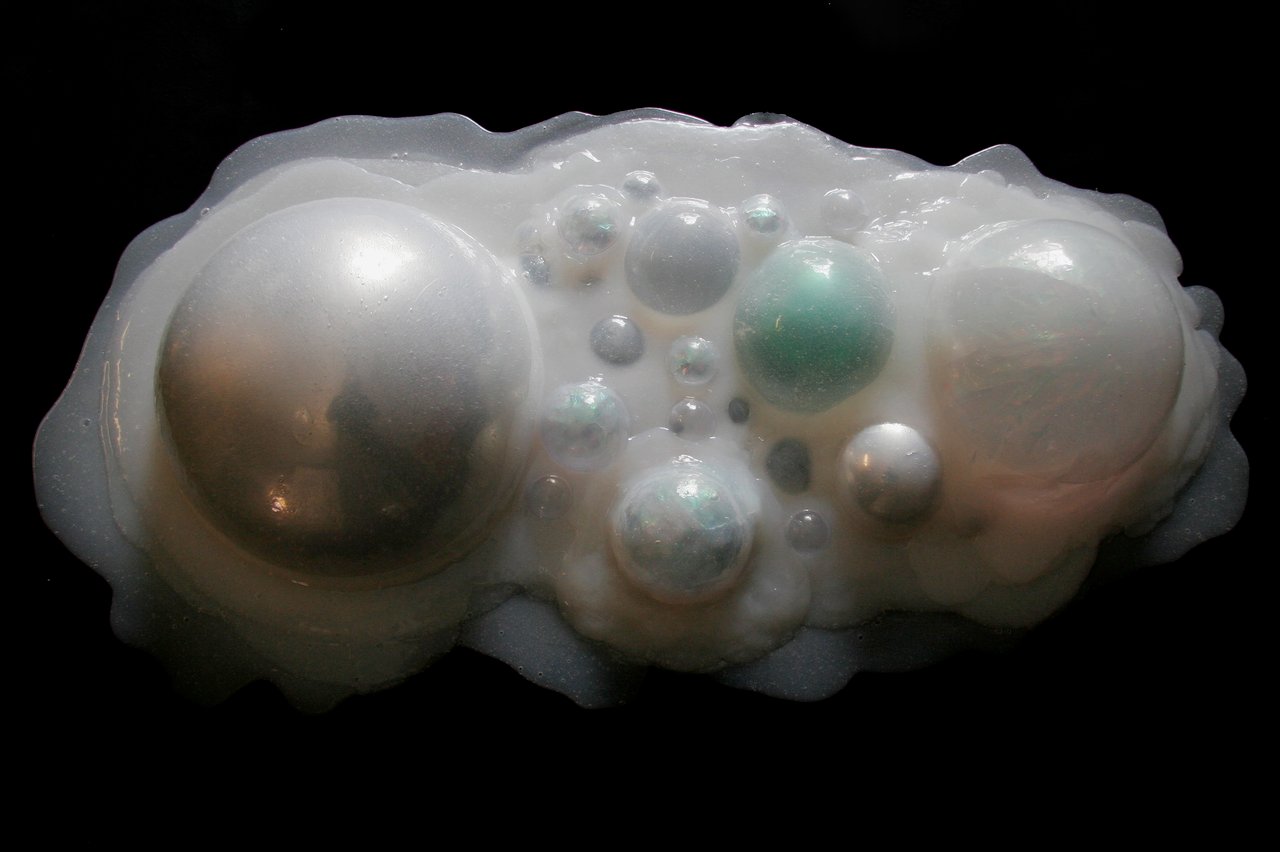 Grimanesa Amorós AURORA PEARL, 20 x 40 x 7-inch light sculpture inspired by the natural phenomenon of the Northern Lights, exploring light as a material that creates presence without physicality, part of the AURORA series of mixed media light sculptures. Light sculpture by Grimanesa Amorós, 2008.