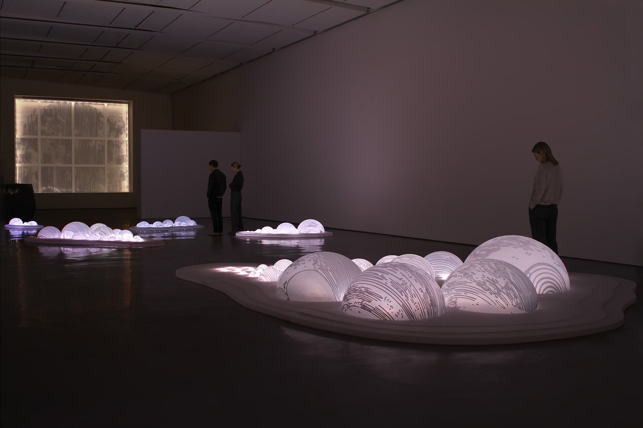 Grimanesa Amorós LIGHT BETWEEN THE ISLANDS, 128 x 28 x 19-foot series of light sculptures made of polycarbonate bubble domes handmade from individual molds and silkscreened with totora reed imagery, illuminated from within and arranged as floating islands that shift from ethereal glow to solid mass as natural light changes throughout the day. Exhibited at Litvak Gallery, Tel Aviv, Israel, 2013.