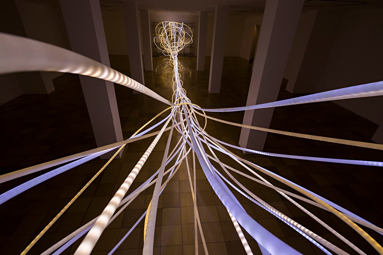Grimanesa Amorós OCUPANTE, LED sculpture and light sculpture that transcends borders and forges connections between individuals and cultures, blurring the line between observer and occupant within the Ludwig Museum's symbolic space at the Deutsche Eck, where fragments of the Berlin Wall pay tribute to the victims of division. Exhibited at the Ludwig Museum, Koblenz, Germany, 2016.