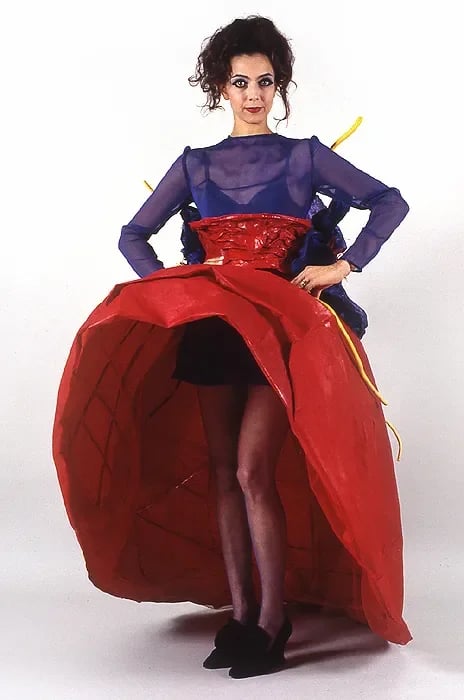 Grimanesa Amorós GOBBENE, 6 x 4.5 x 2.5-foot wearable artwork modeled by Angela Ingrao, created for Pulp Fashion, a runway event celebrating the creativity of paper, curated by Nina Felshin and Elise Siegel featuring 18 leading New York City artists. Exhibited at Pulp Fashion Paper Mill, New York, 1995, and later as part of The Body Eclectic traveling exhibition at the Spruill Center for the Arts, Atlanta, 1997.