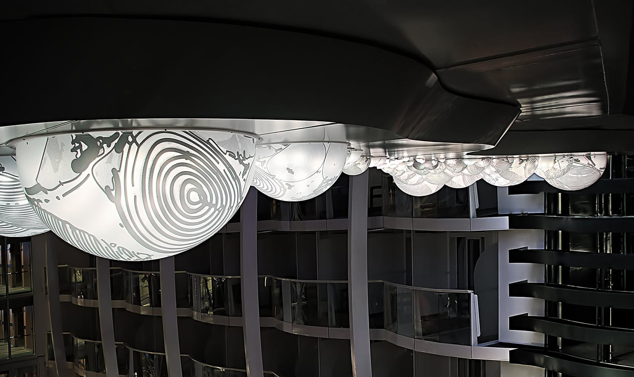 Grimanesa Amorós RACIMO, 26 x 46-foot public art outdoor LED sculpture and light sculpture on the Allure of the Seas, the world's largest cruise ship, launched in Turku, Finland, 2011. Made of stainless steel, diffusion and reflective material, and LEDs, the silkscreened domes depict the vineyards of Pisco, Peru, a tribute to the artist's childhood memories of grapevines. Commissioned by ICART for Royal Caribbean. Outdoor light sculpture by Grimanesa Amorós.