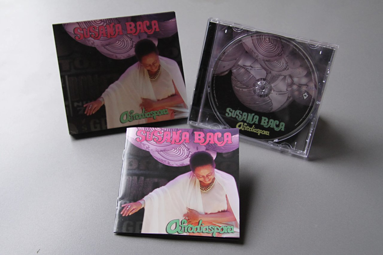 Grimanesa Amorós AFRODIASPORA, 5.5 x 5-inch CD album cover and booklet design created for Grammy Award-winning Peruvian singer Susana Baca's album Afrodiaspora, a musical travelog spanning centuries and continents through songs of the African Diaspora including rhythms from Cuba, Argentina, New Orleans, and beyond. Collaboration by Grimanesa Amorós for Susana Baca's European Tour, 2011.