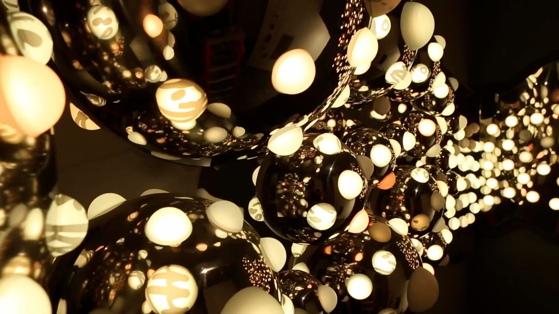 First frame of the hero video — a light installation by artist Grimanesa Amorós